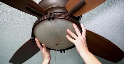 Ceiling fan repair and reinstallation on ceiling mount in Scottsdale, AZ