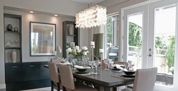 Elegant dining room chandelier installation above table in Scottsdale, AZ