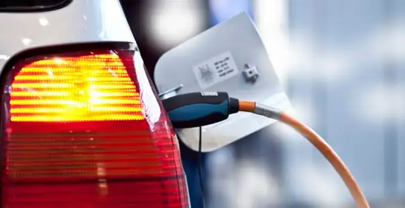 Electric car plugged into EV charger after professional installation in Scottsdale, AZ