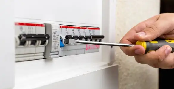 electrical panel upgrade service showing technician adjusting circuit breakers during system upgrade in Scottsdale, AZ