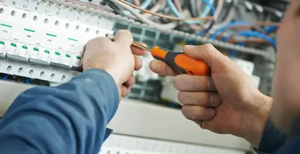 electrical service showing licensed electrician performing electrical panel maintenance and adjustments in Scottsdale, AZ
