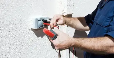 Electrician performing home electrical outlet and wiring inspection in Scottsdale, AZ
