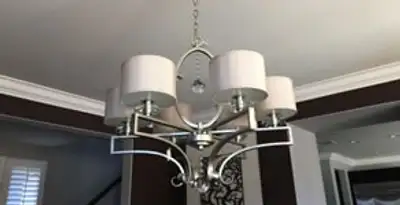 Modern chandelier installation with multiple light fixtures in Scottsdale, AZ