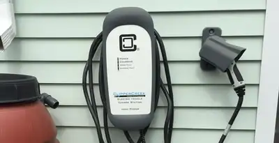 Outdoor electric vehicle charger installation on residential wall in Scottsdale, AZ