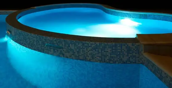 pool light installation and repair services highlighting illuminated pool interior lighting in Scottsdale, AZ