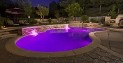 pool light installation and repair services illuminating a residential swimming pool in Scottsdale, AZ