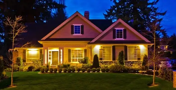 security light installation services illuminating a residential exterior at night in Scottsdale, AZ
