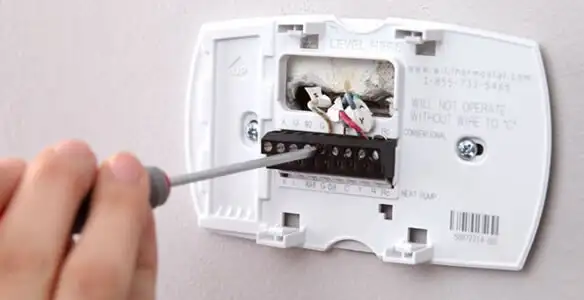 Thermostat installation service with proper wiring and secure wall mounting in Scottsdale, AZ