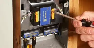 Whole home surge protection device being installed by a licensed electrician to protect electrical systems in Scottsdale, AZ
